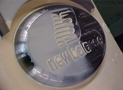 Logo engraved into a polished mold cavity